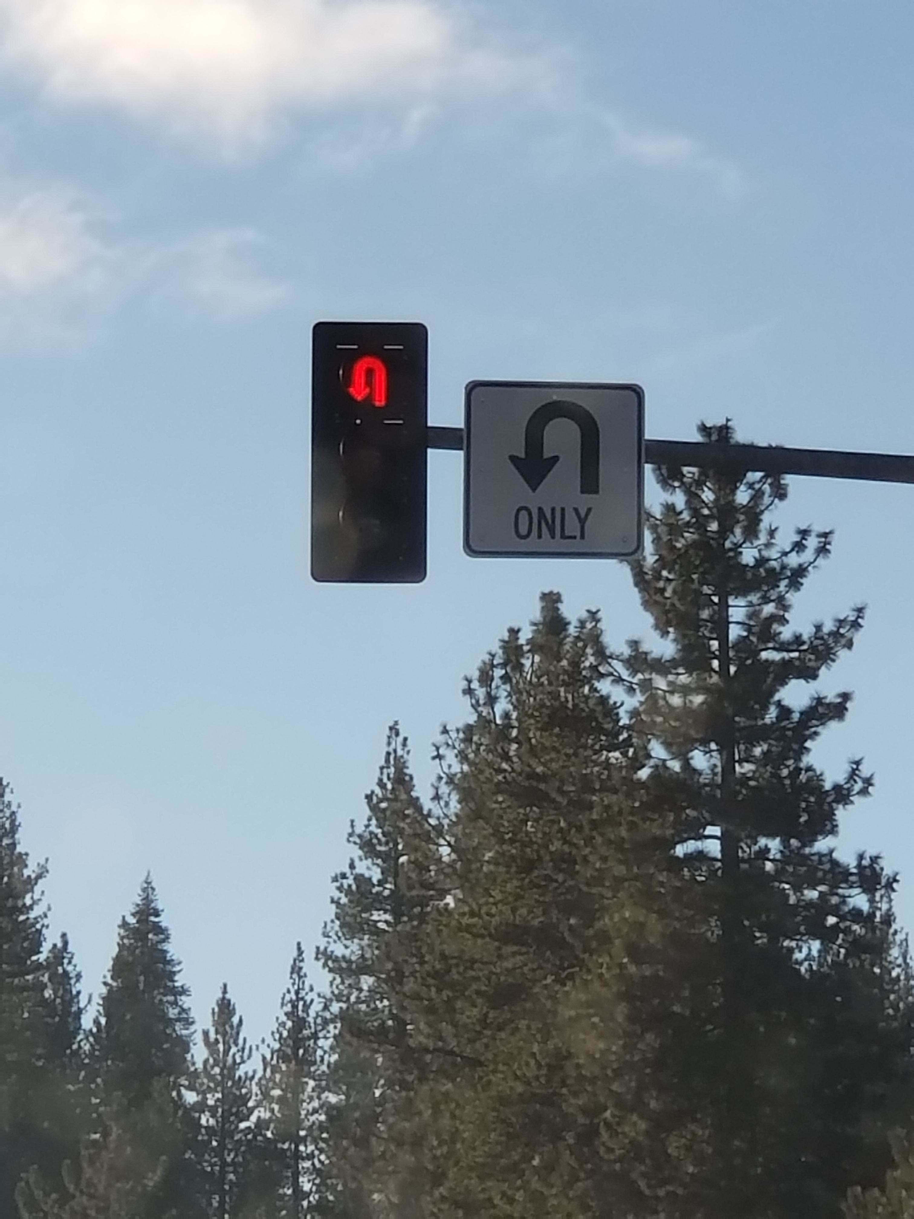A red u-turn stoplight