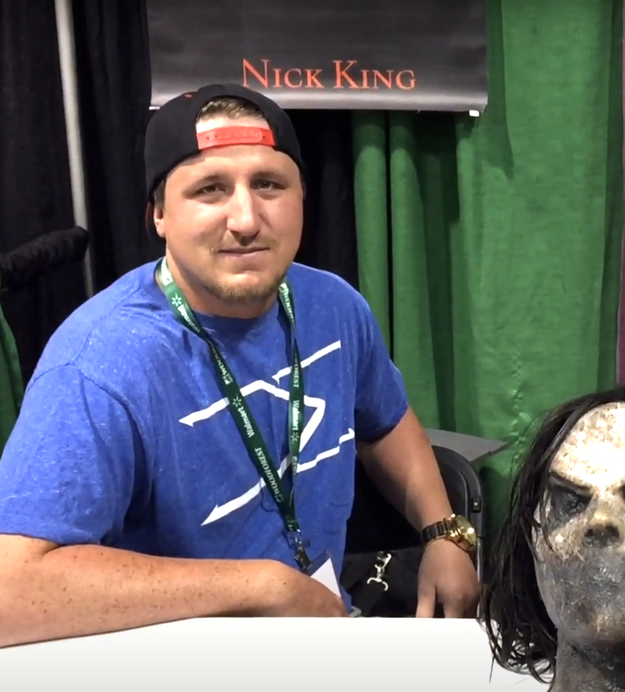 Nick King next to a mask of Bughuul