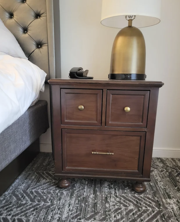A night stand with a face on it