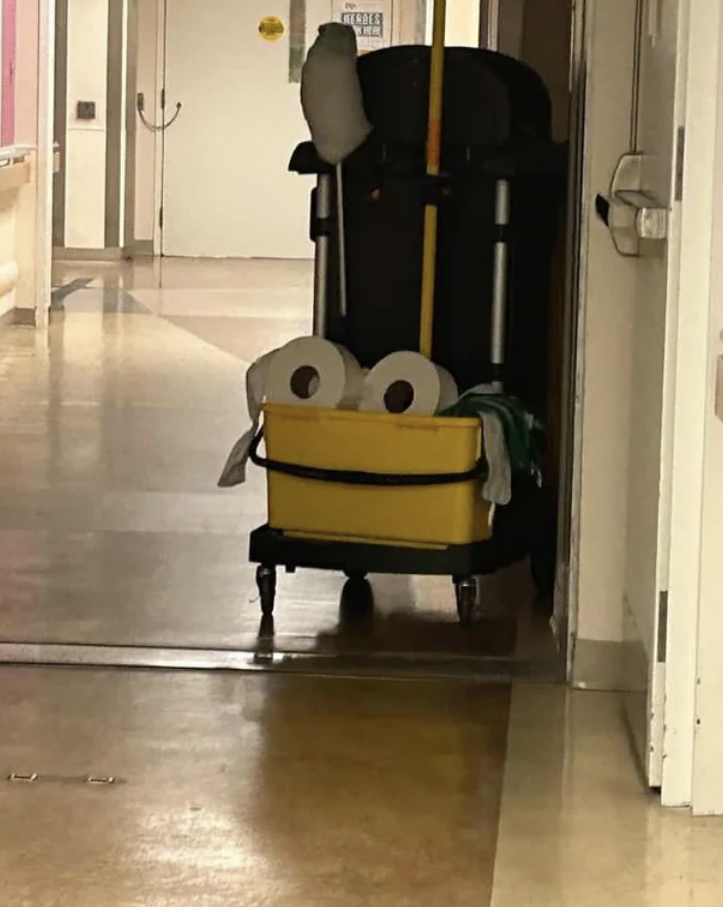 a face on a cleaning cart