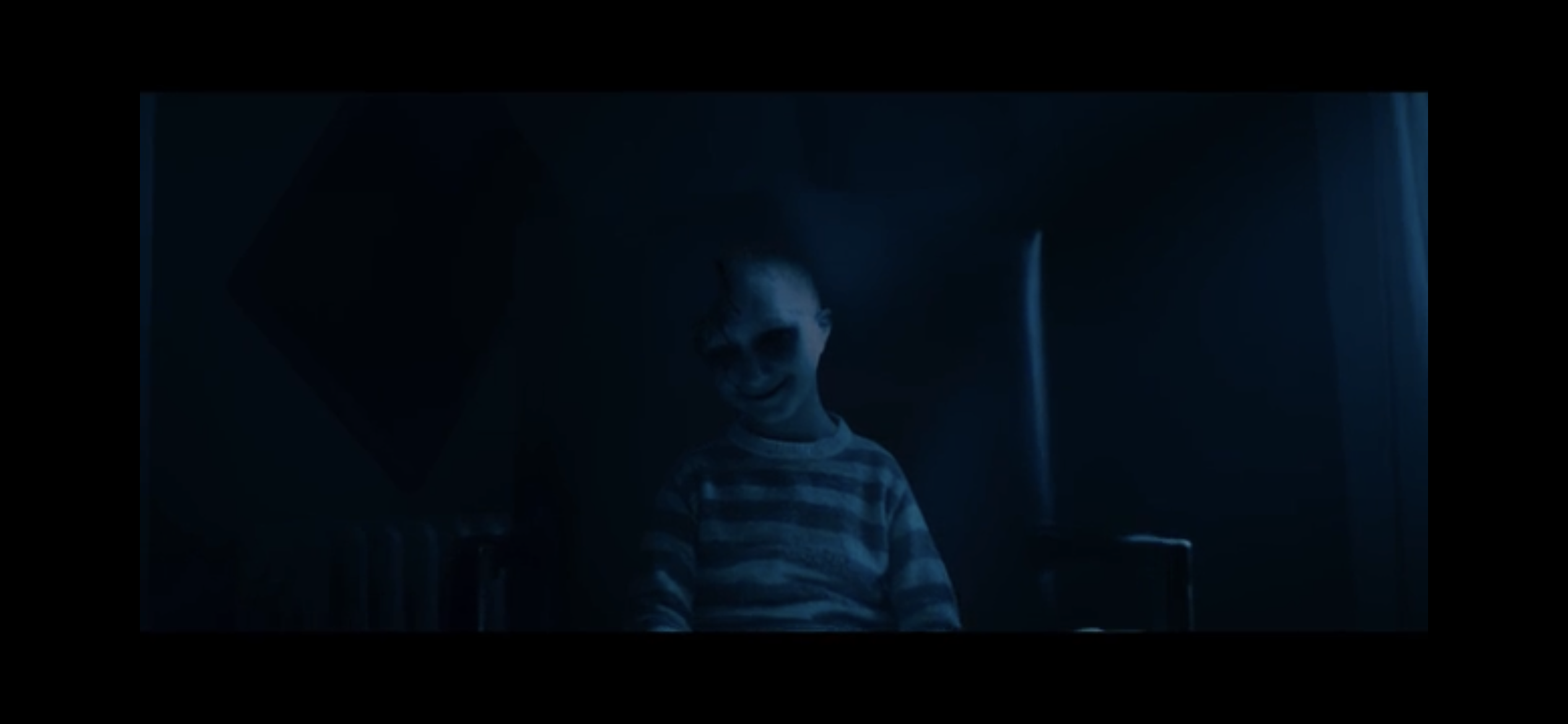 A creepy child in the dark