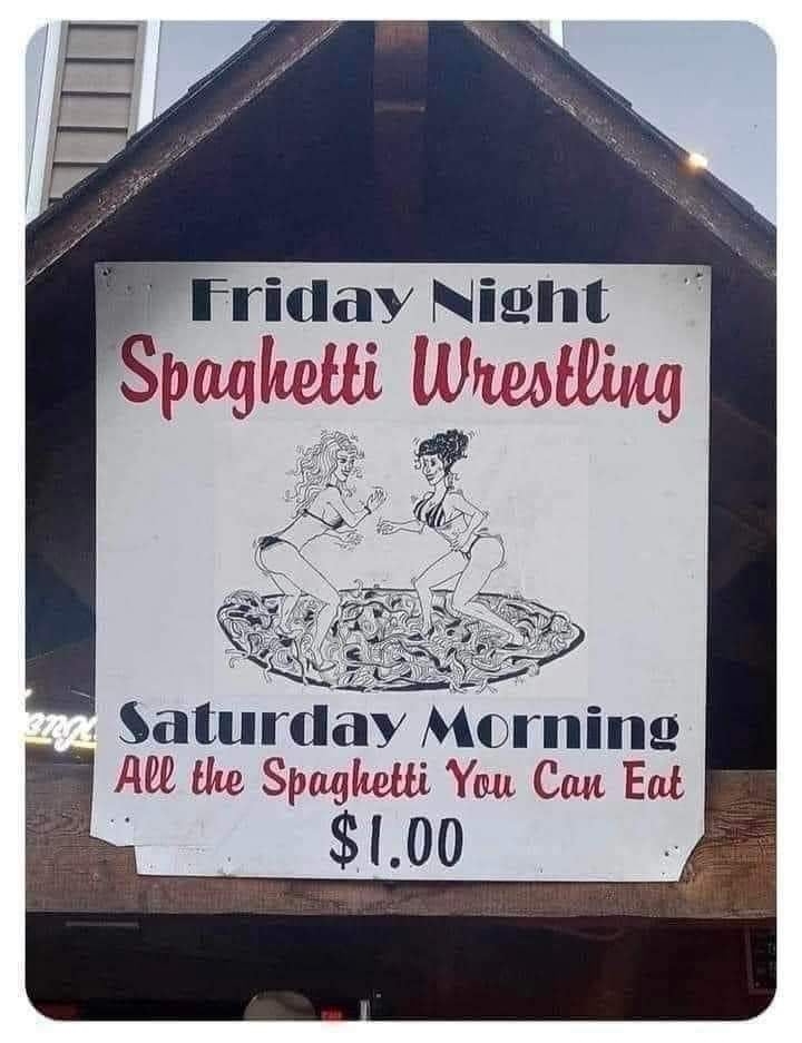 Sign announcing &quot;Friday night spaghetti wrestling&quot; and &quot;Saturday morning all the spaghetti you can eat for $1&quot;
