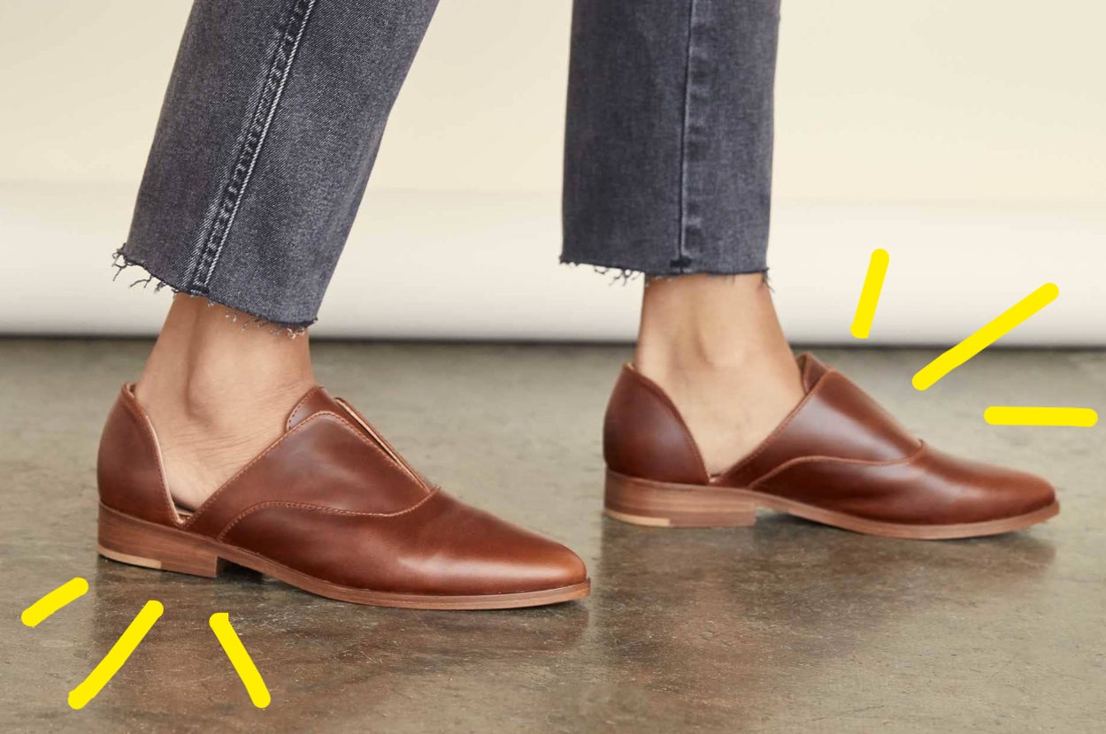 a model wearing a pair of leather flats