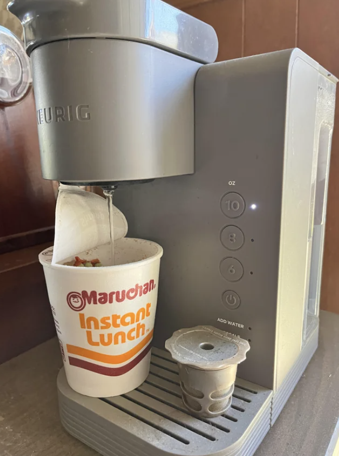 A ramen cup in a Keurig machine