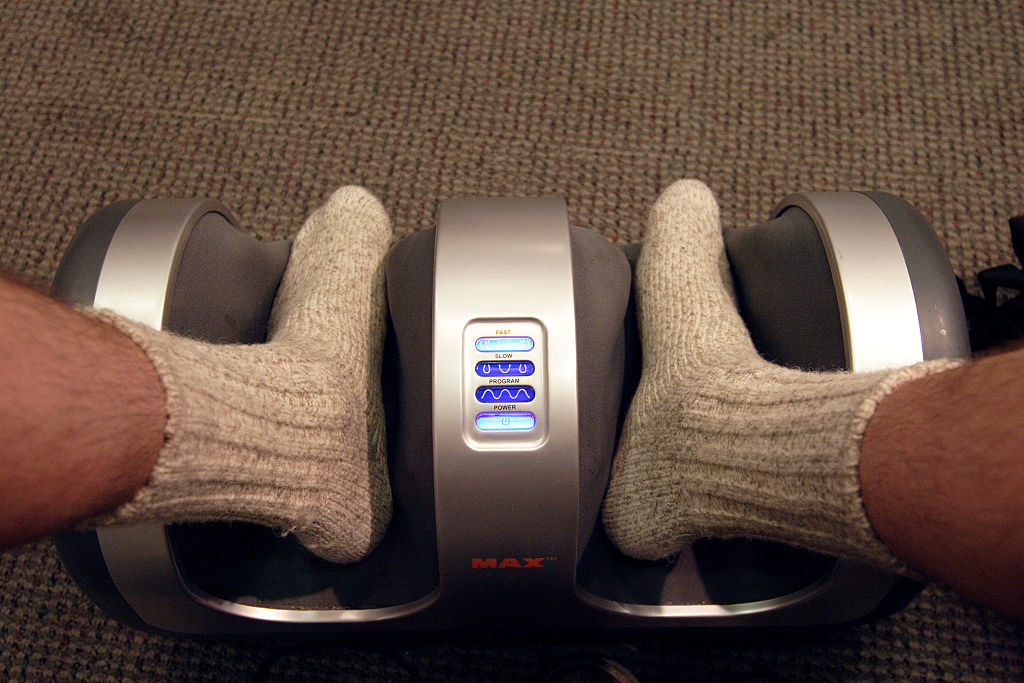 a person&#x27;s feet in a foot massager