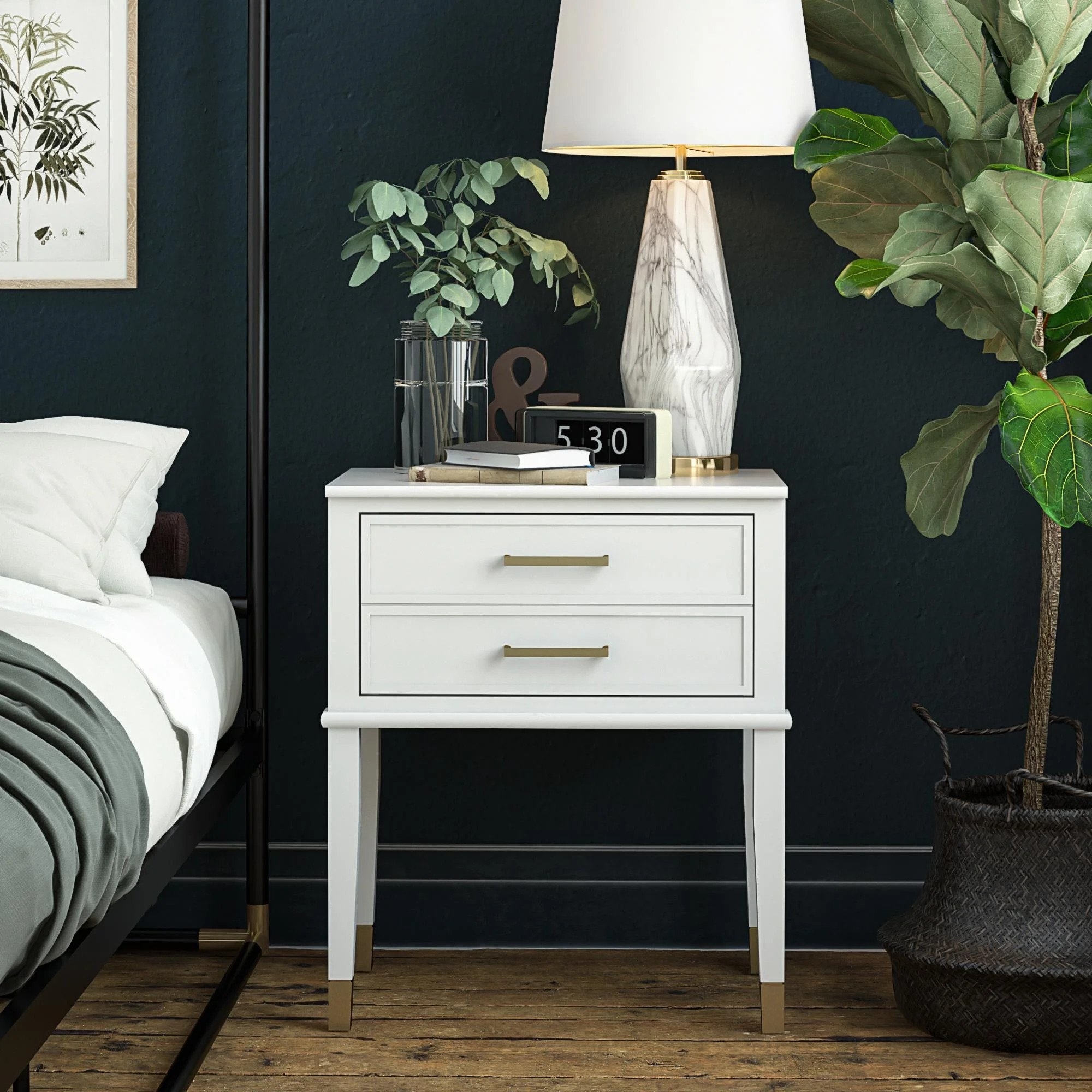 The nightstand in white with brass finishes