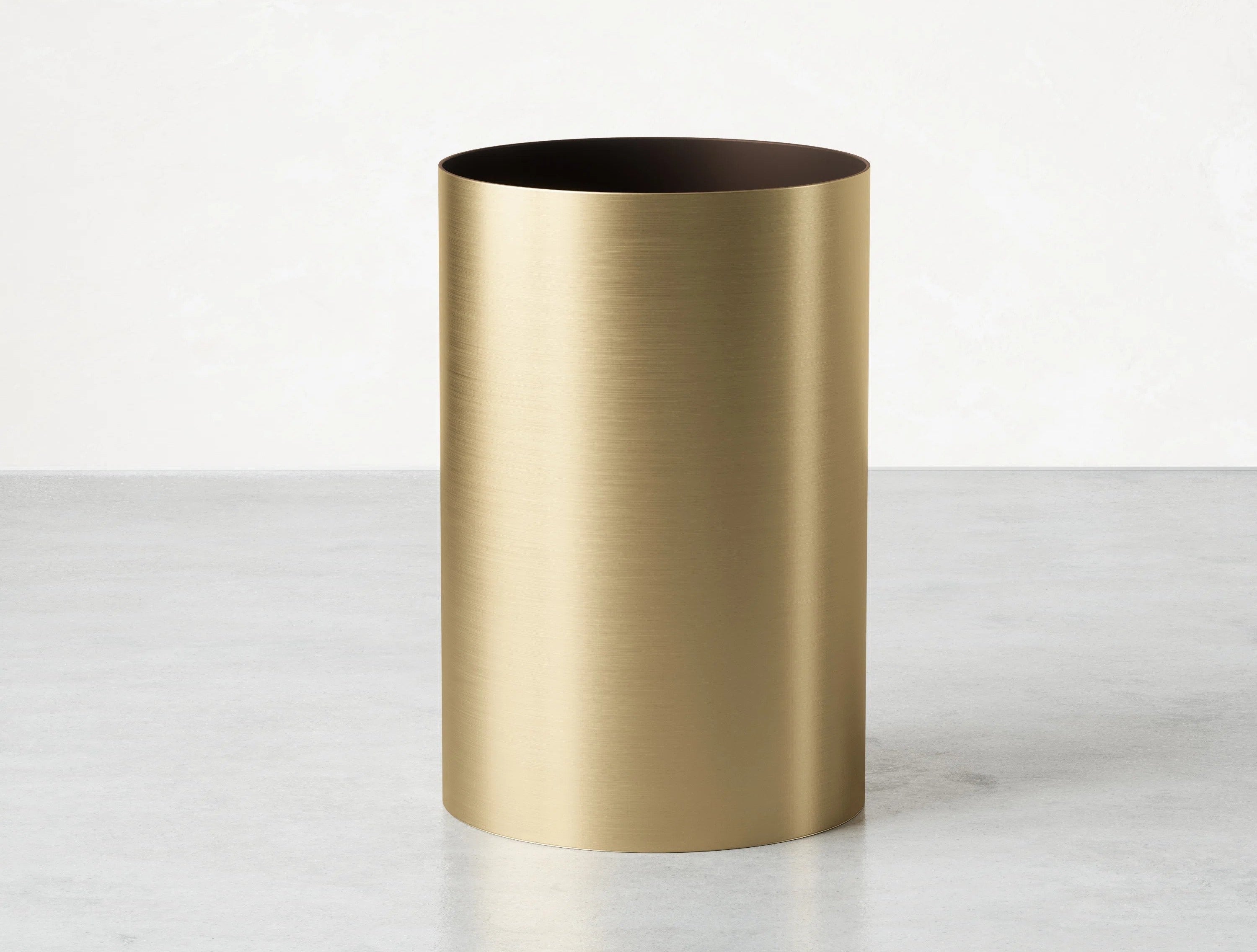 The lidless brass trash can