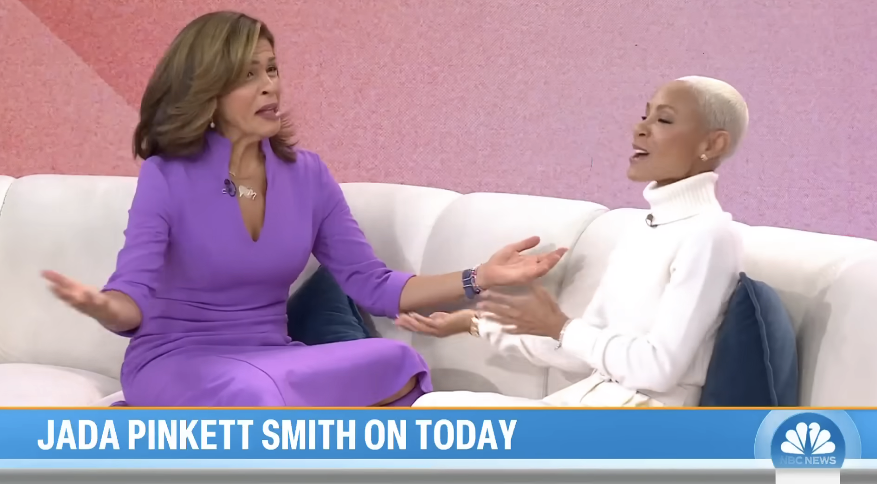 hoda with her arms stretched out in question during the interview with jada