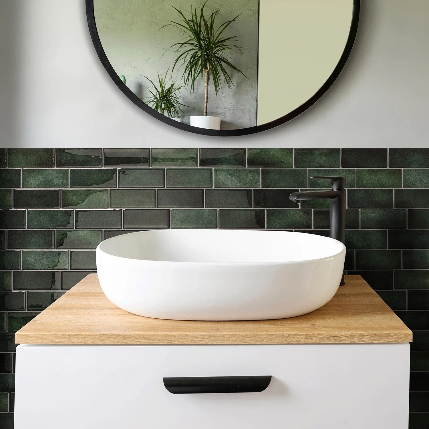 The tiles in green, shown behind a bathroom sink