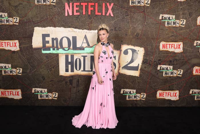 millie wearing a long dress for the enola holms premiere