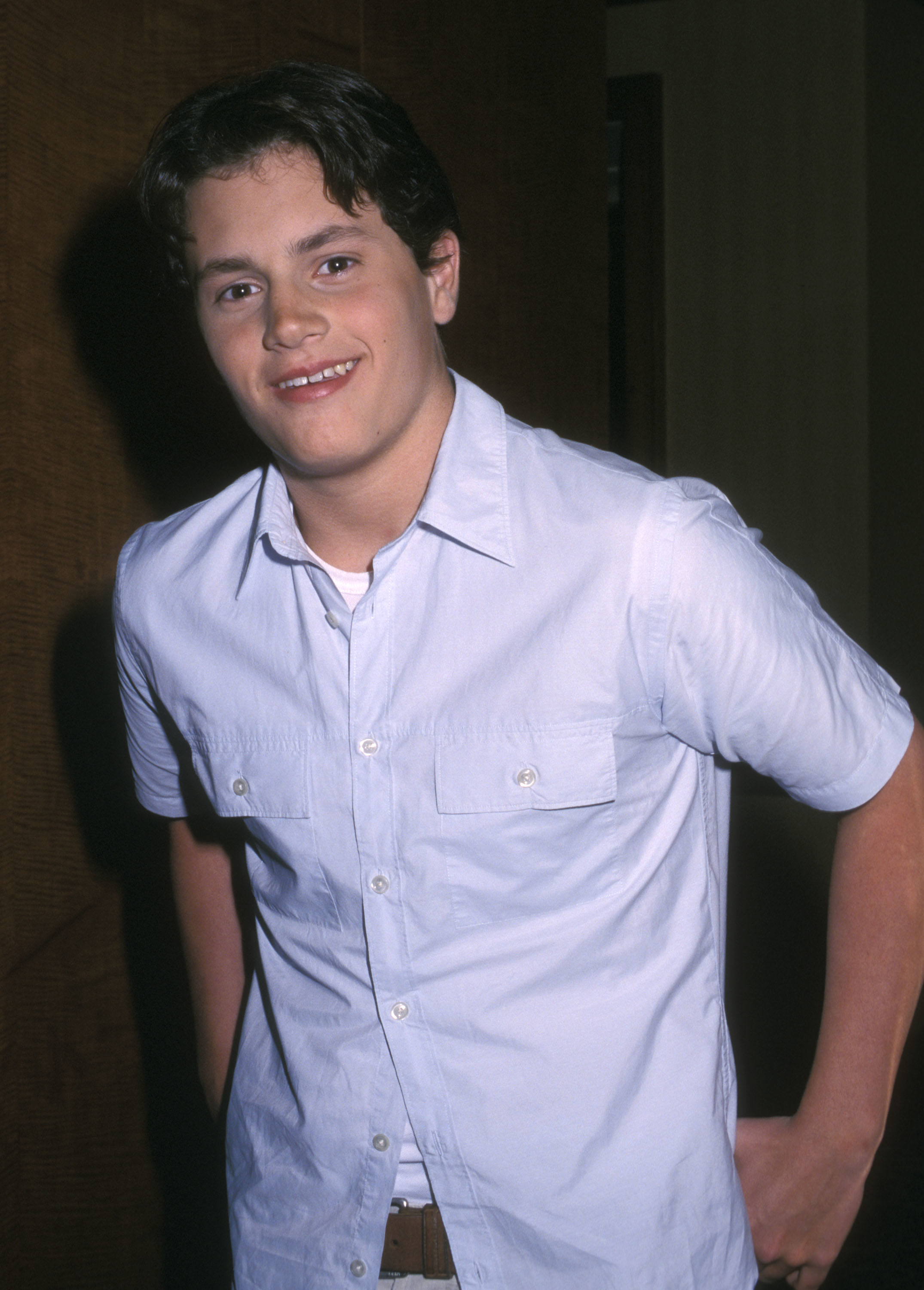 closeup of him in a short-sleeved button-down