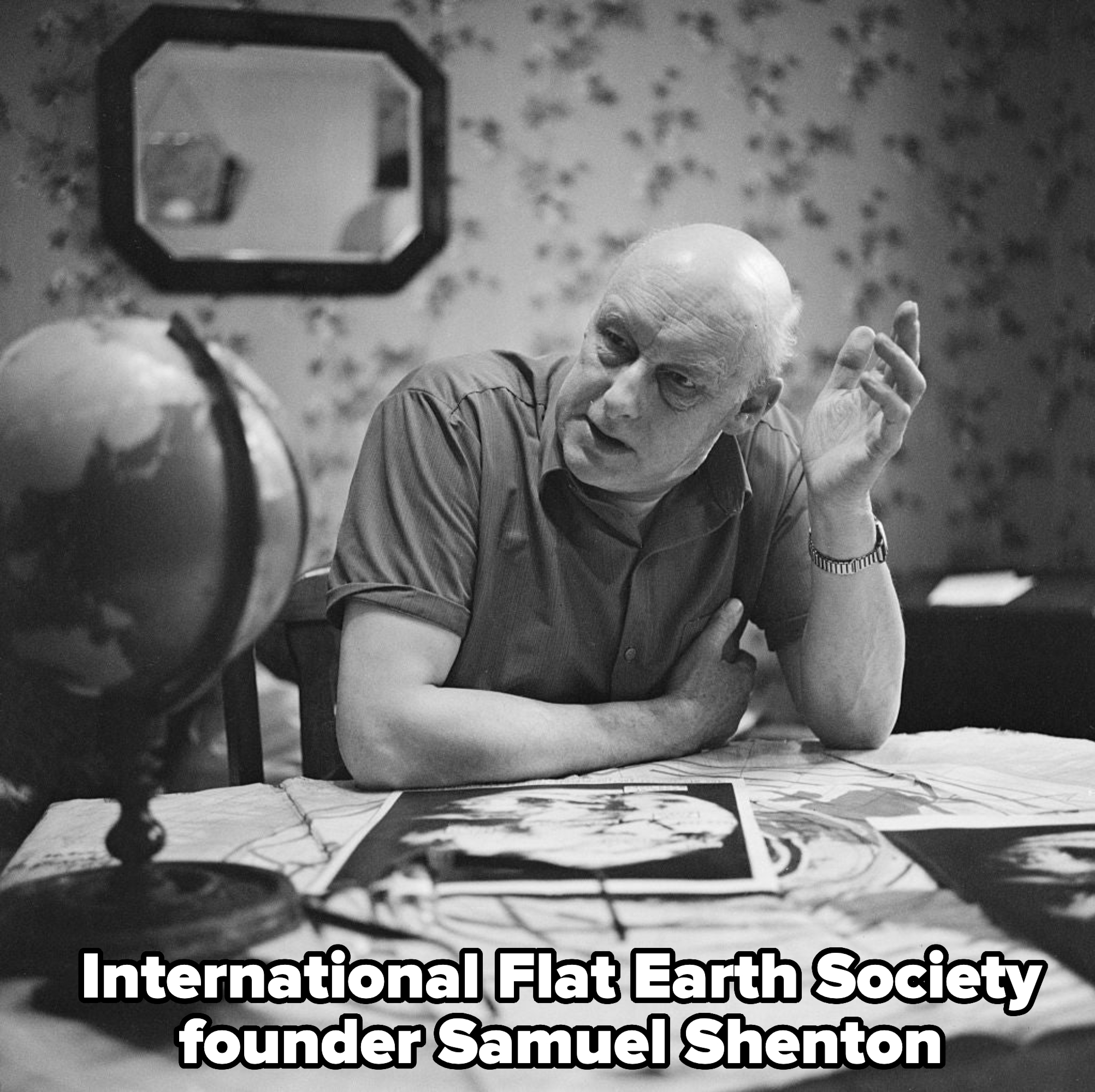 man at a desk with a globe with text, international flat earth society founder, samuel shenton