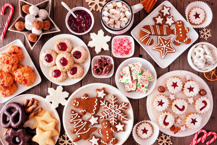 Plates filled with holiday cookies and desserts