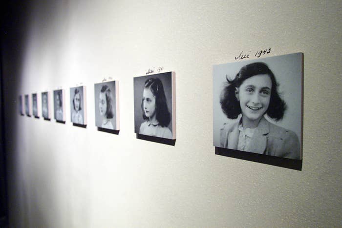 Photos of Anne Frank on a wall