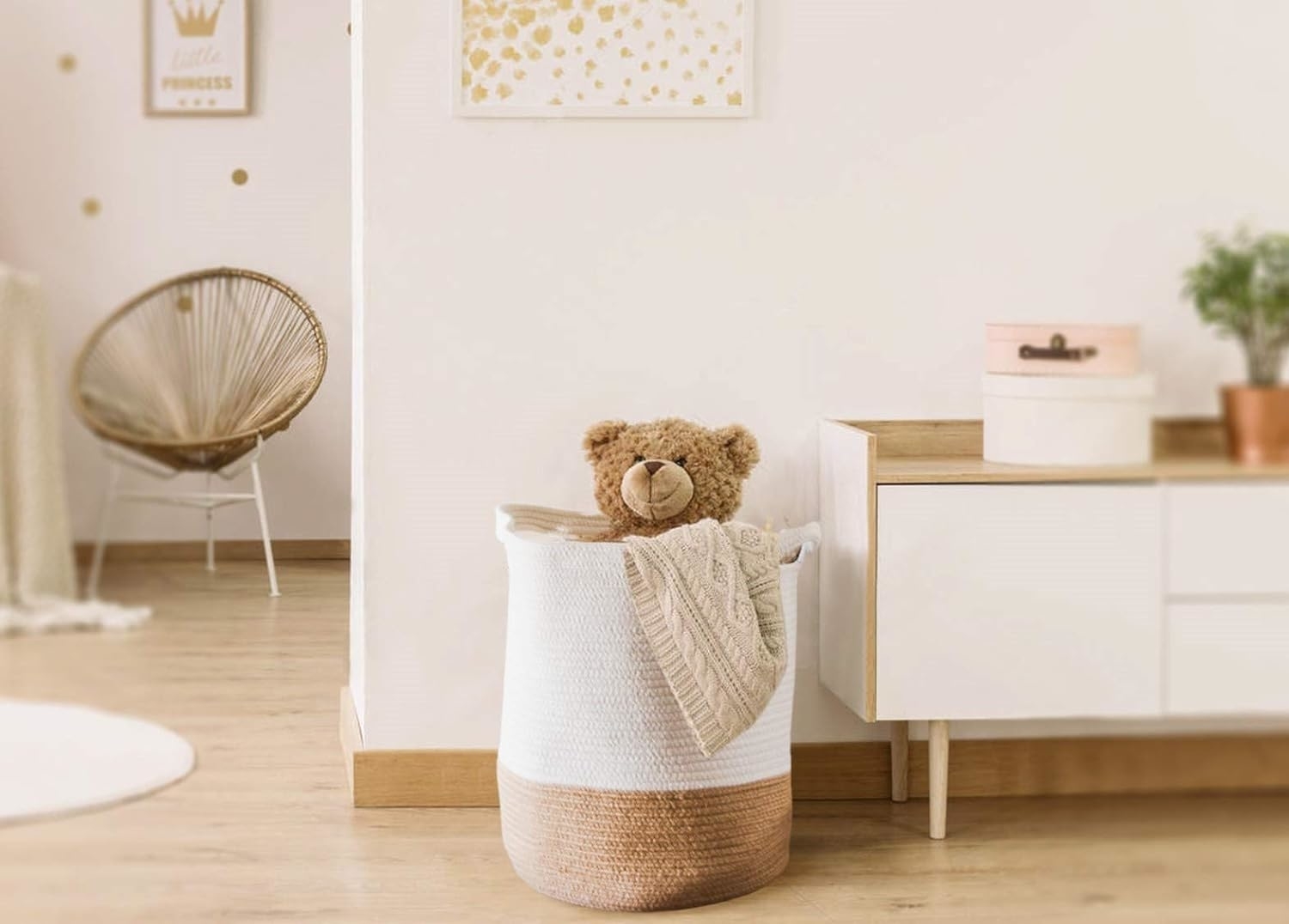 the woven basket holding a blanket and a teddy bear
