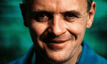 Anthony Hopkins as Hannibal Lecter smiling creepily into the camera