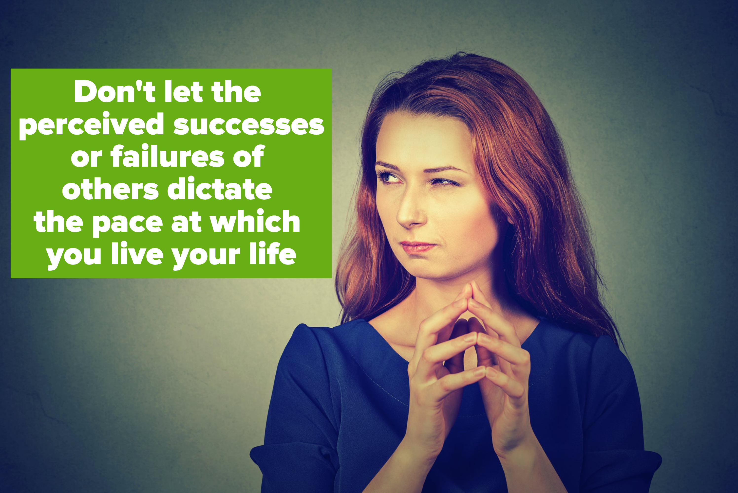 A woman scrunching her eyebrows with her hands together