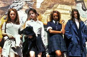 The Craft girls against a wall.