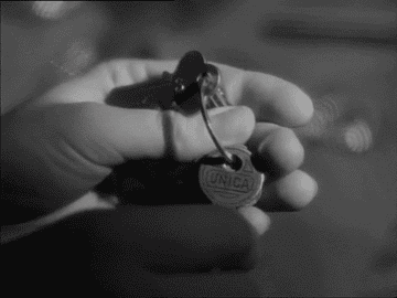 A hand holding keys