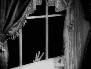 A hand hitting a window