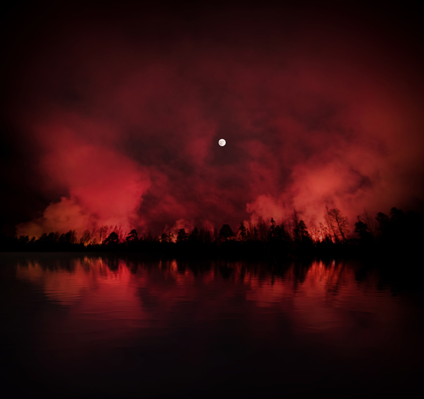 A red sky with a bright moon