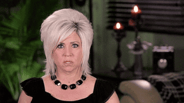 GIF of a woman making a shocked face