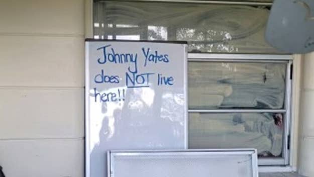 a whiteboard sign outside a home
