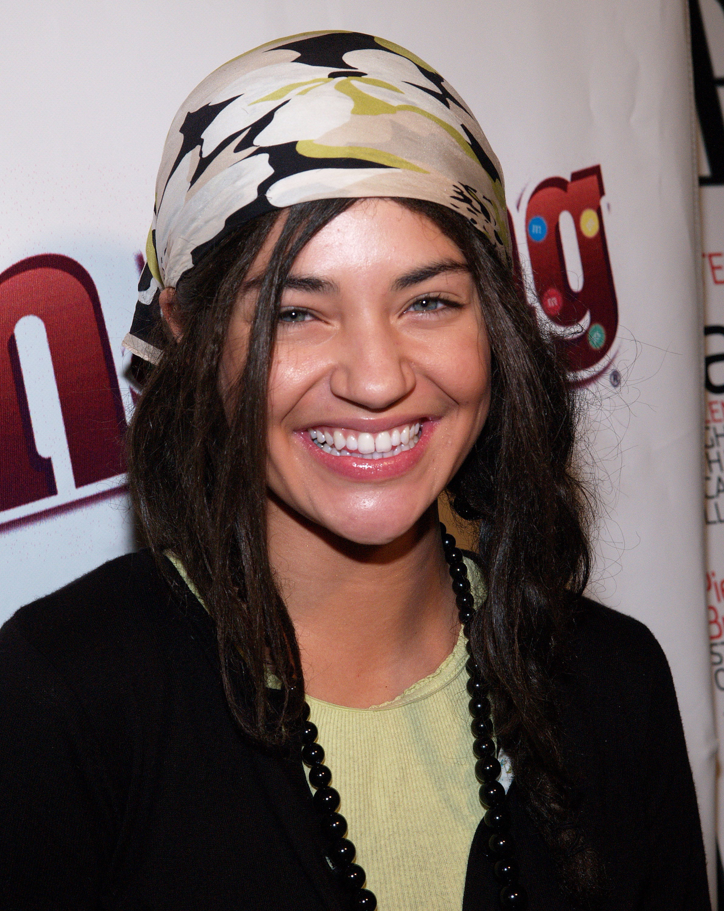closeup of her wearing a bandana on her head