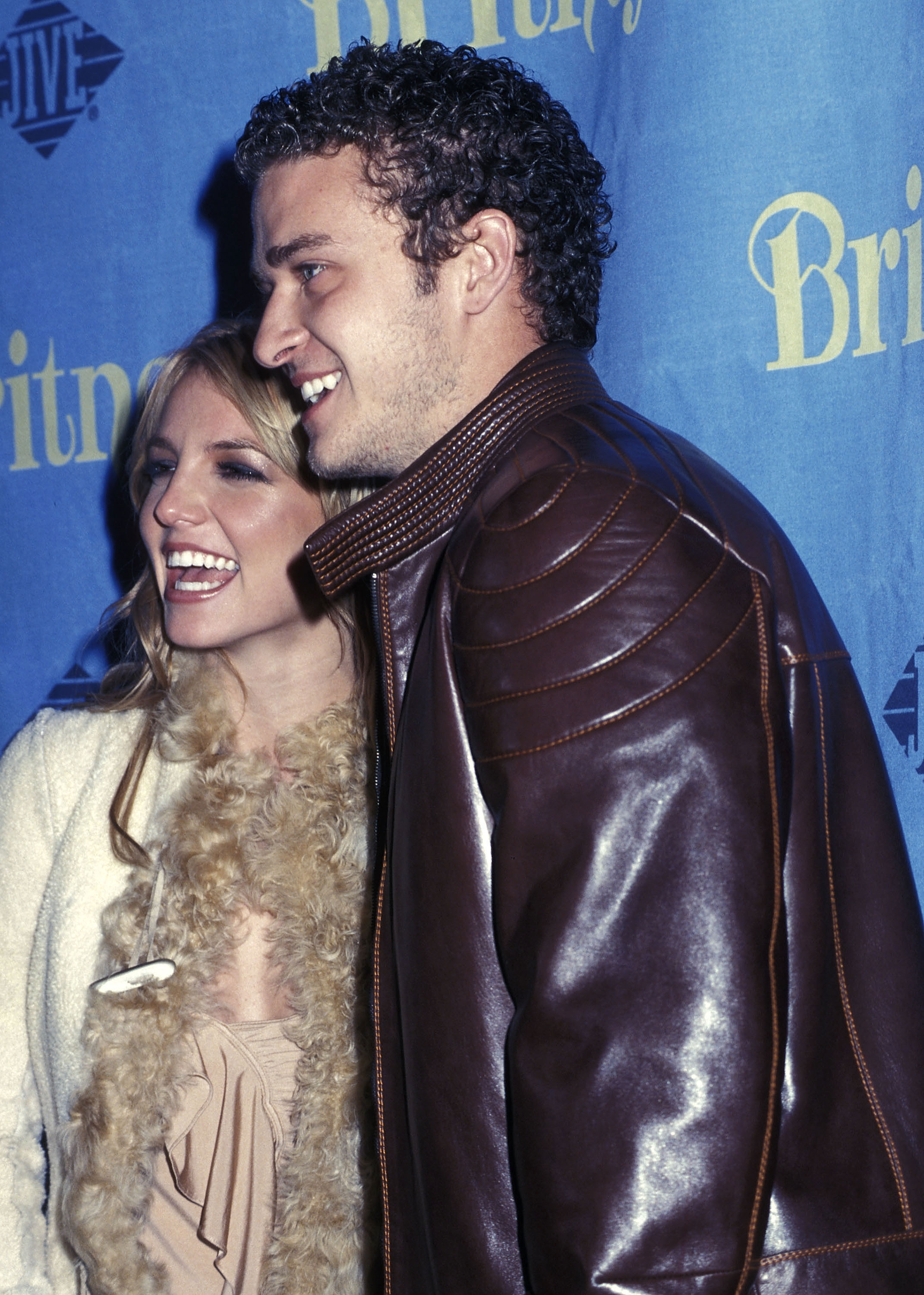 Closeup of Britney and Justin smiling for photographers on the red carpet