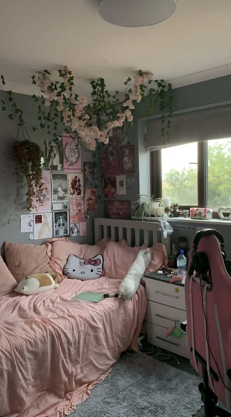 This user&#x27;s Hello Kitty-themed room features a Hello Kitty pillow and a pink, green, and white color scheme