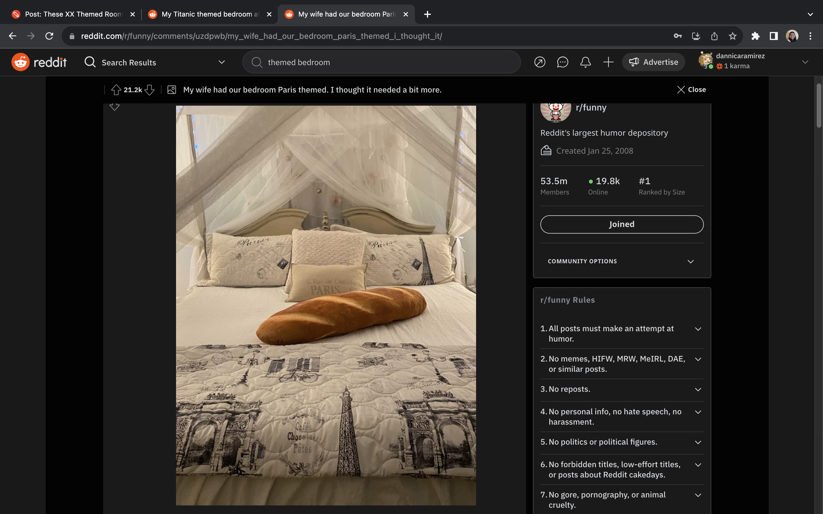 A Paris-themed room consists of bedsheets with prints of popular Parisian monuments in addition to a huge baguette pillow