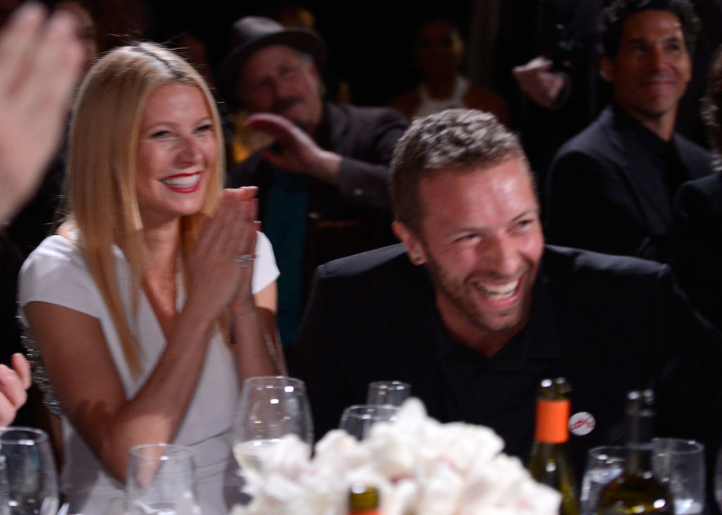 Closeup of Gwyneth and Chris sitting at their table during an event