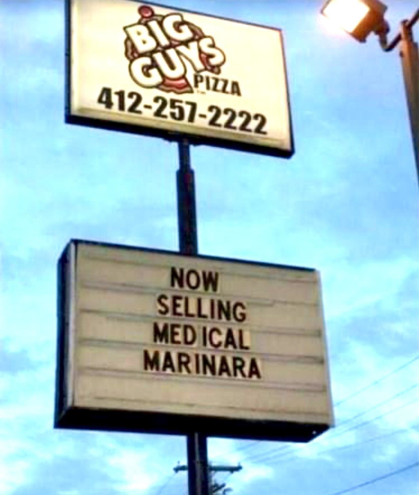 Sign for a pizza place that says &quot;Now selling medical marinara&quot;