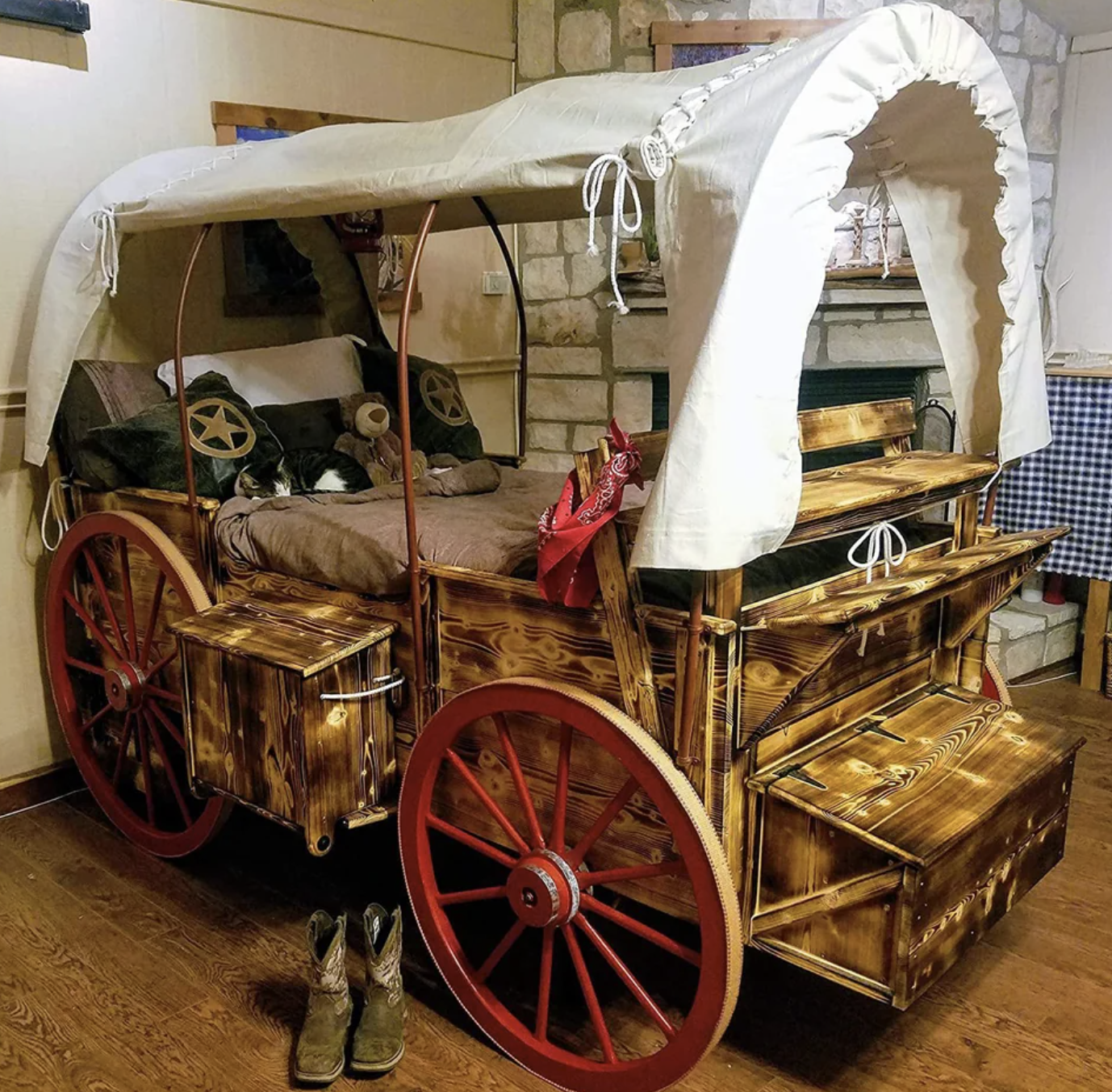 This pilgrim-themed room features a big wagon bed