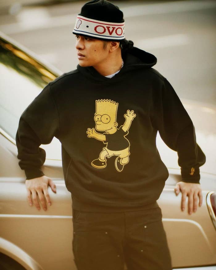 Model wearing Bart Simpson black hoodie