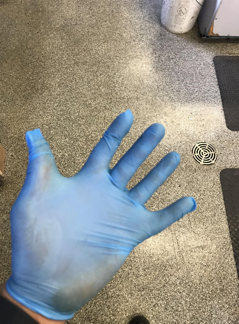 A tight glove on someone's hand