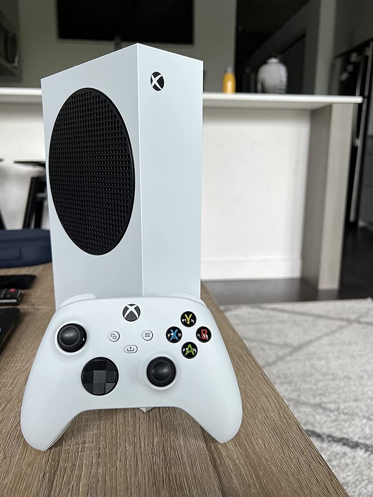 an xbox s and controller