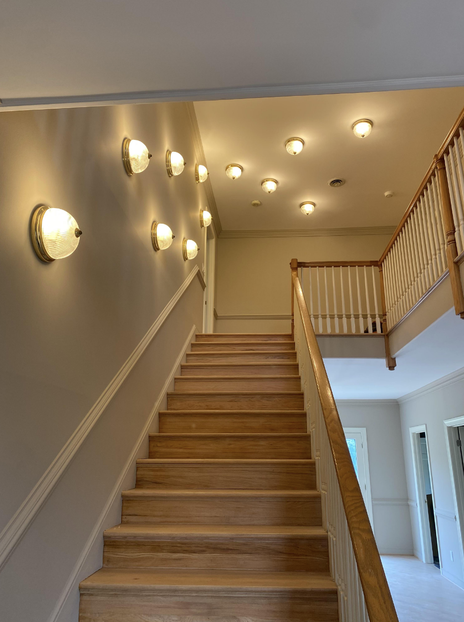 A stairwell with lights all over the walls and ceiling