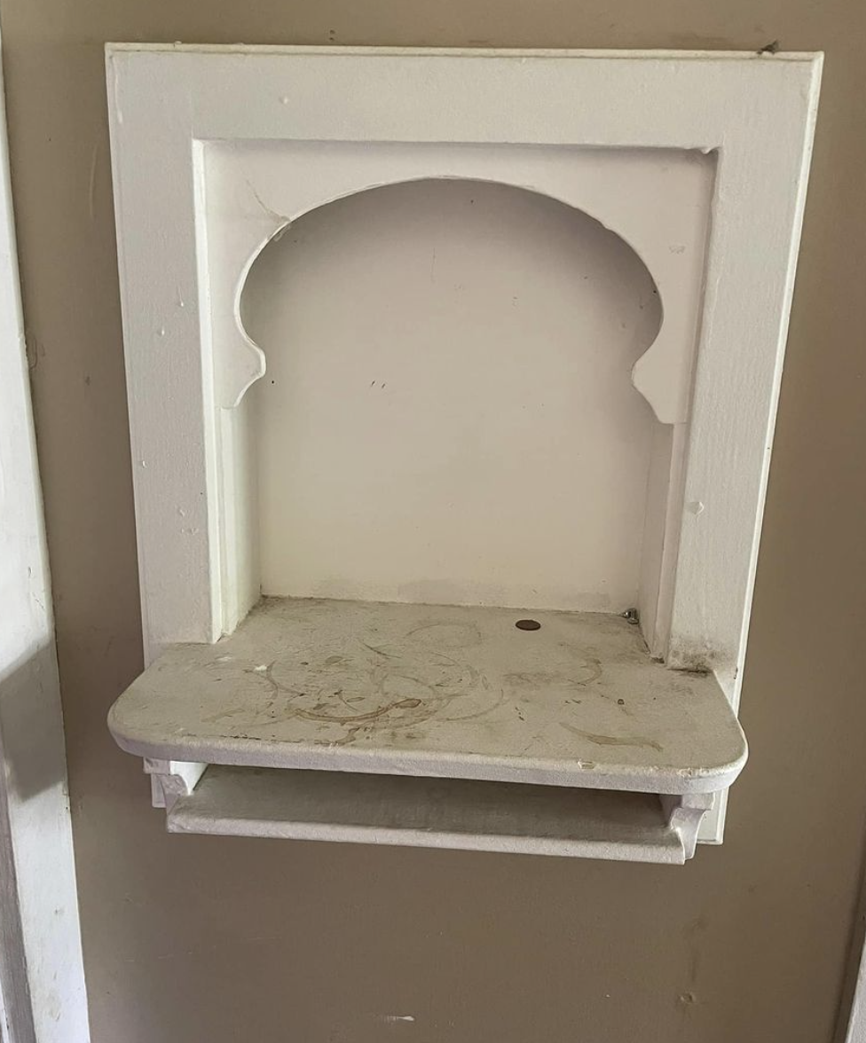 Antique all-wood wall recessed mount shelf for the telephone and telephone book in several coats of chippy paint