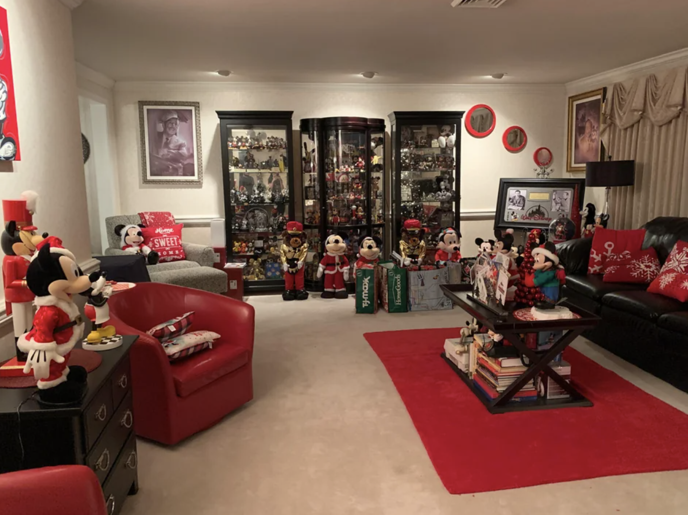 This living room features many Mickey and Minnie figures in Christmas garb