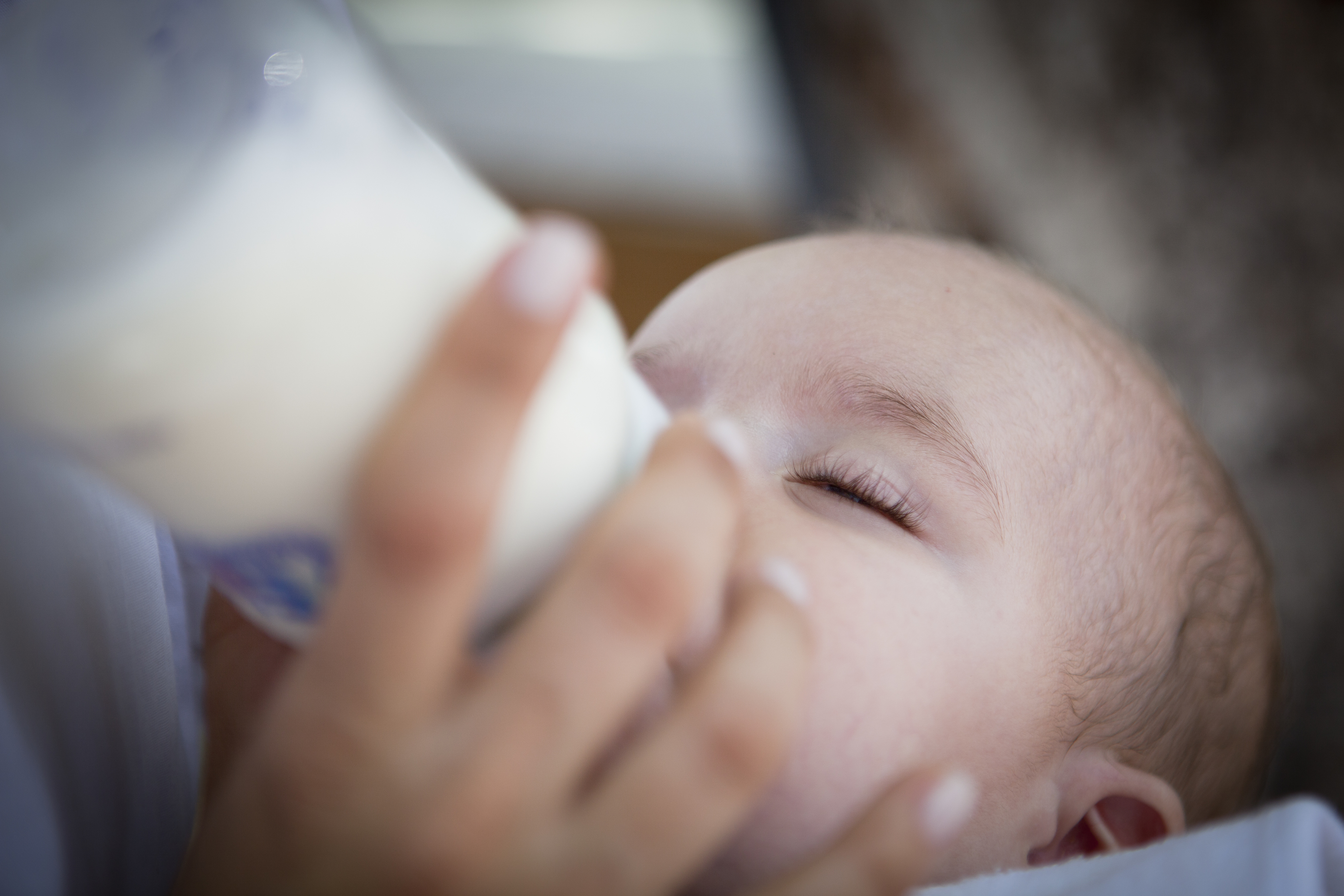 A baby being bottle-fed
