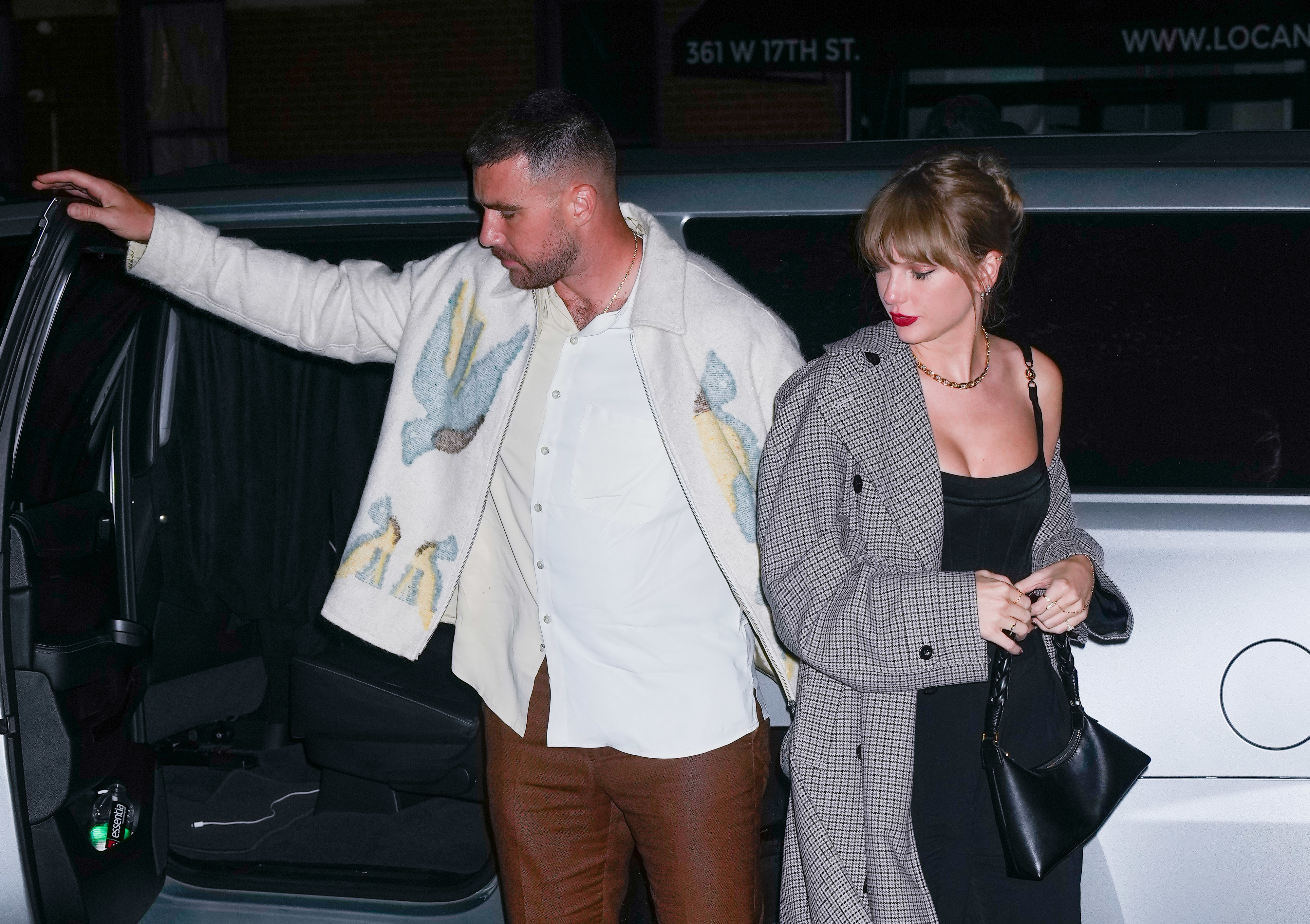 Close-up of Taylor and Travis leaving a car