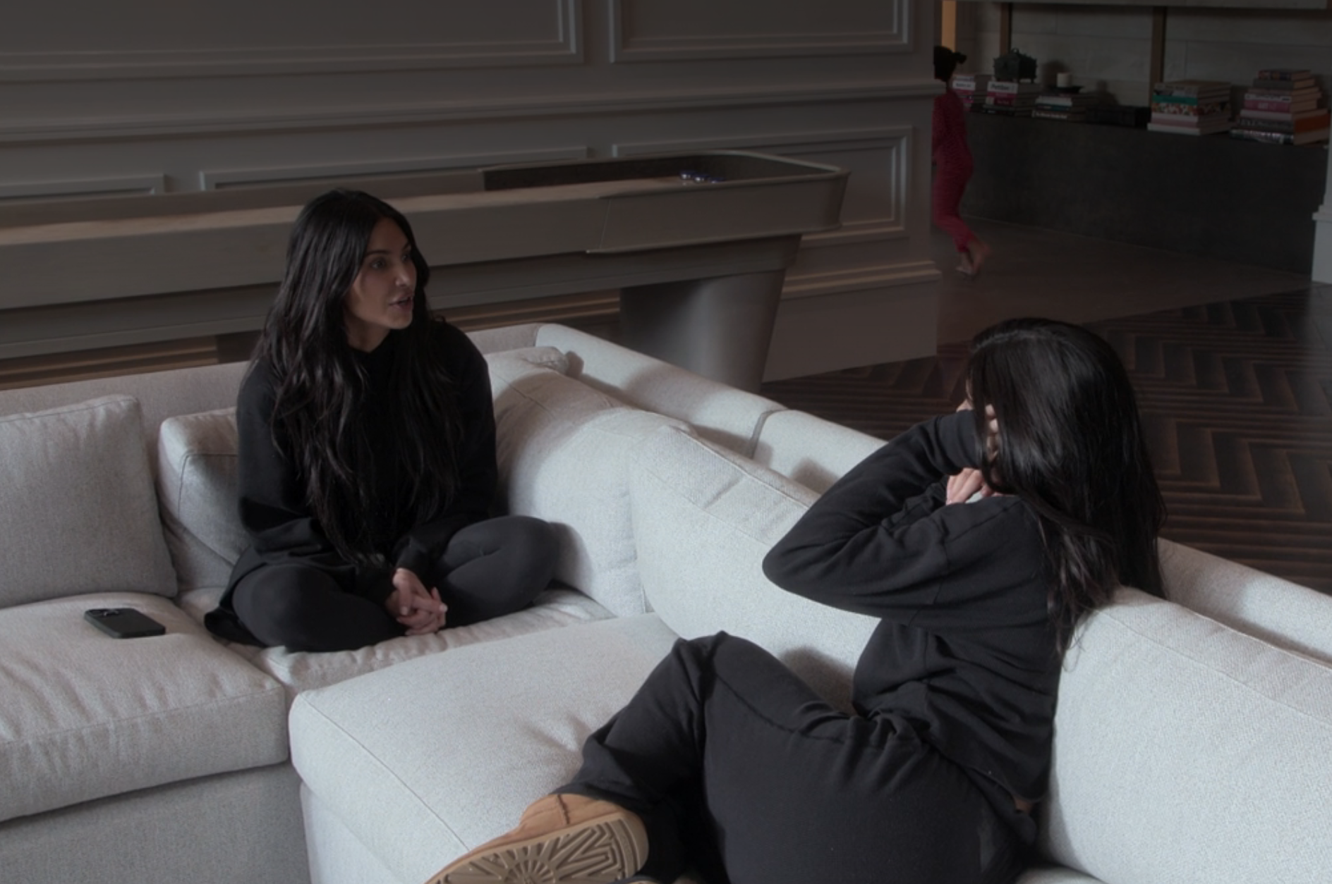 Kim and Kylie sitting on a couch