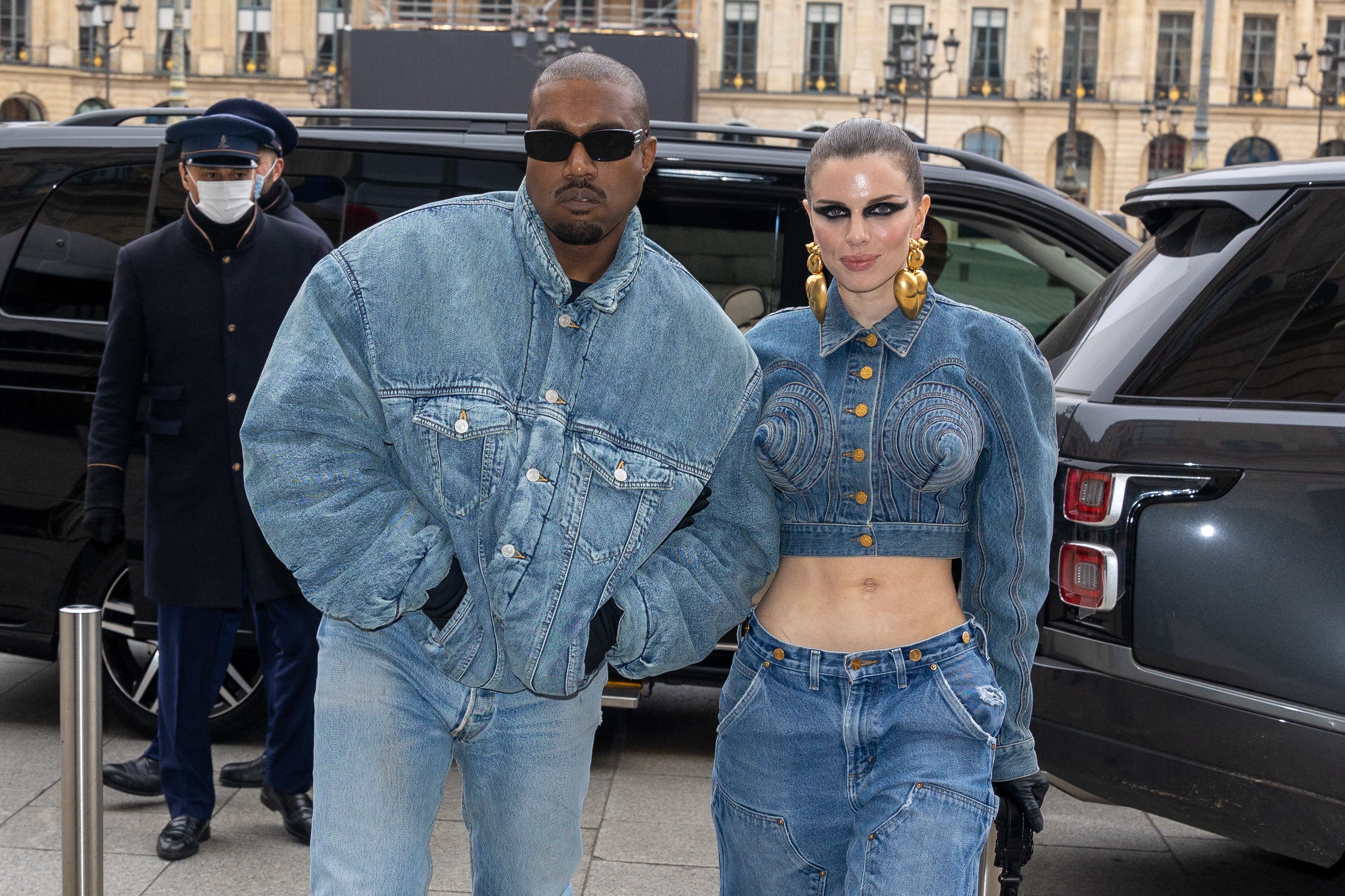 Close-up of Ye and Julia standing together and wearing denim