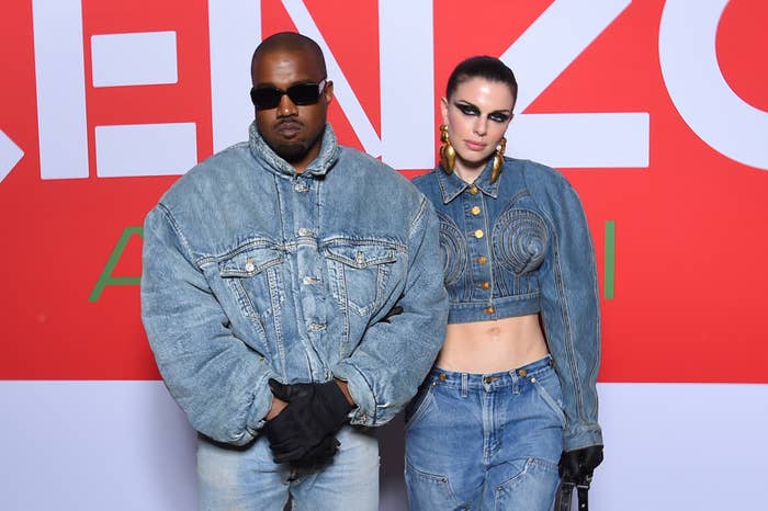 Close-up of Ye and Julia at a media event. Both of them are wearing all denim