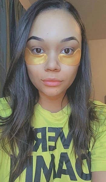 a reviewer with gold under eye patches