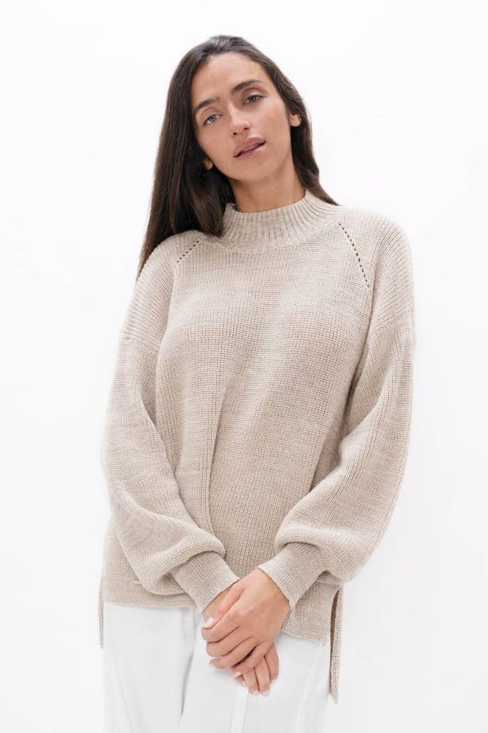 model wearing the sand colored sweater