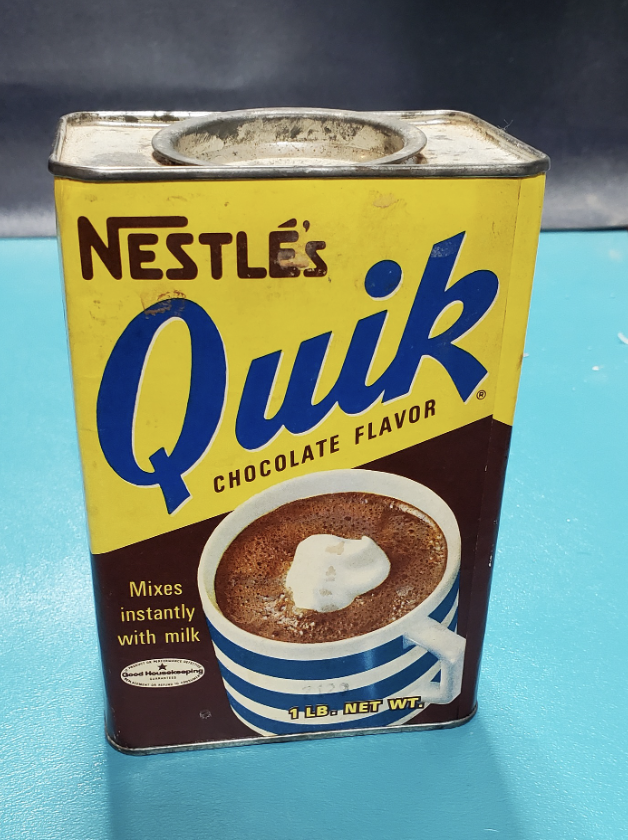 A tin container of Nestlé&#x27;s Quik mix