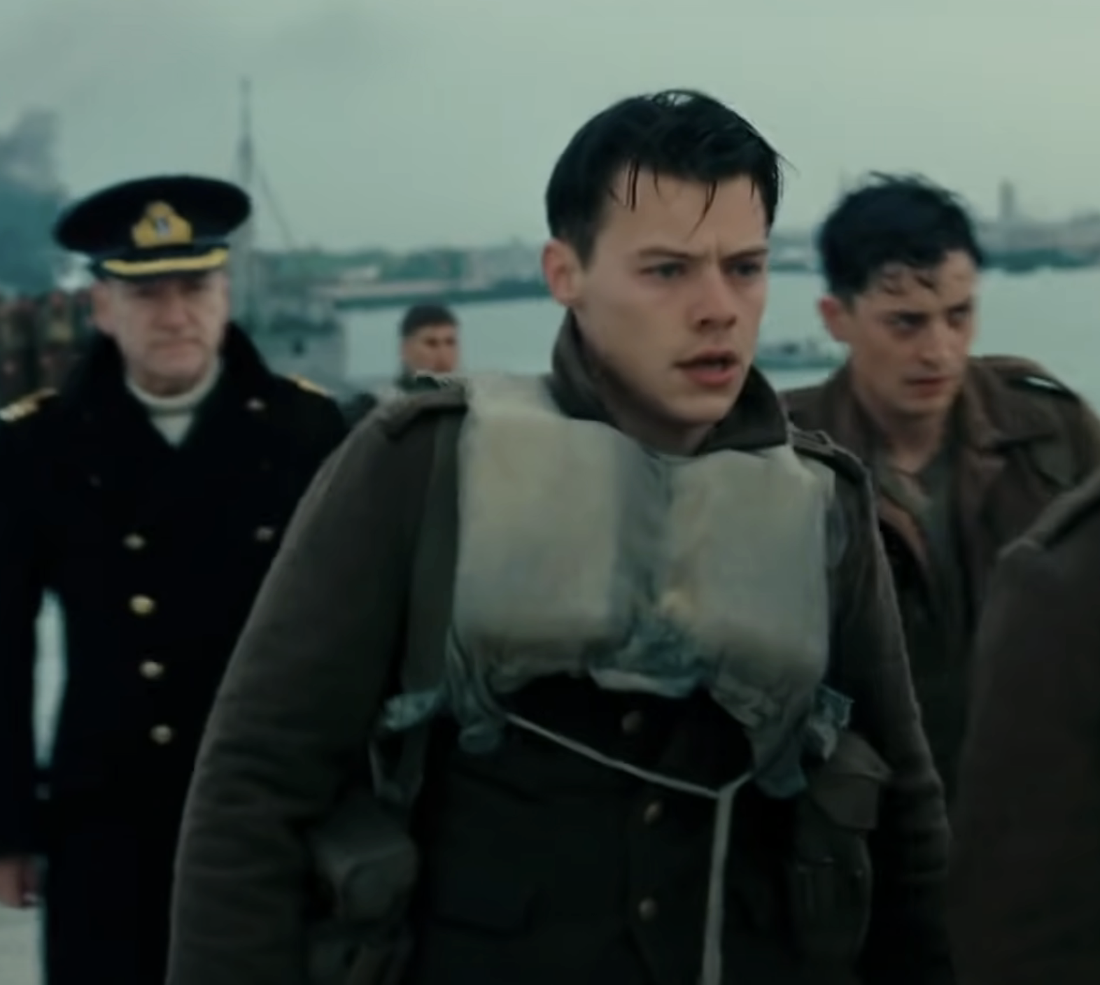harry wearing a life vest and military uniform in the film