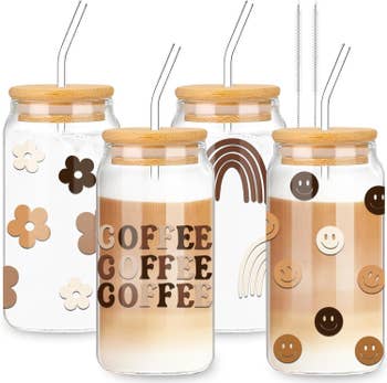 four coffee glasses with a variety of neutral colored designs on them